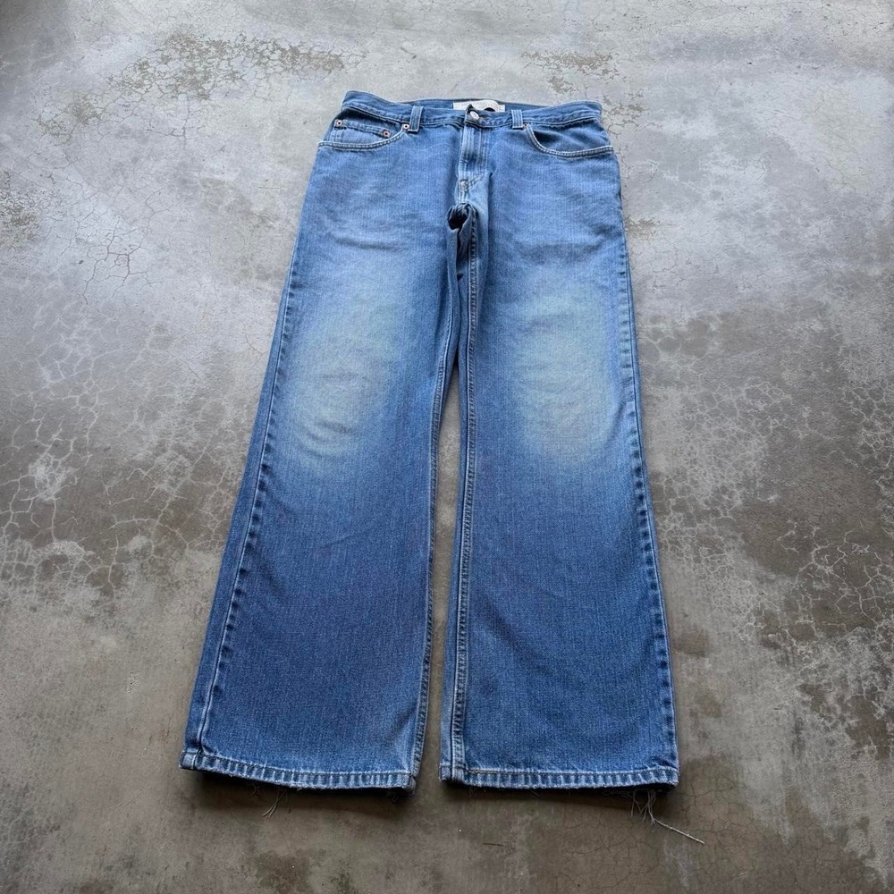 Vintage Levi's 557 bootcut denim jeans flare wide leg  Measures 33x31
